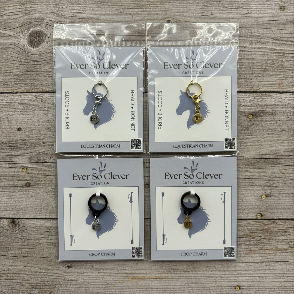 Four packages of BFF charms in Ever So Clever Creations packaging on wood surface