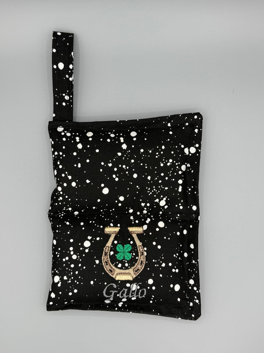 Black and White Speckled horse bit warmer open with outside displayed