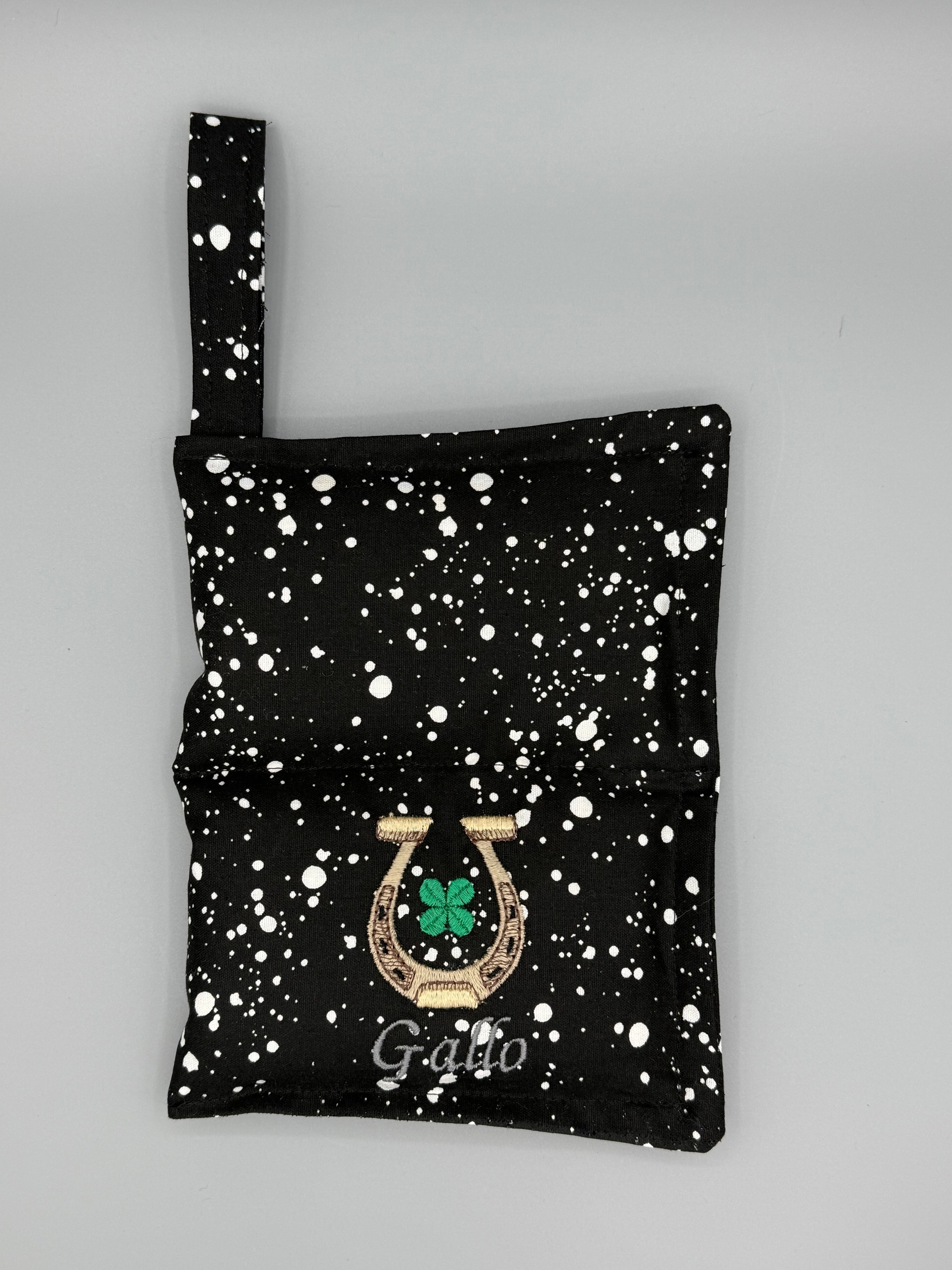 Black and White Speckled horse bit warmer open with outside displayed