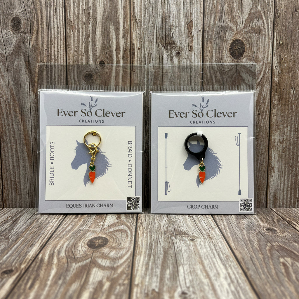 Two packages of Ever So Clever Creations carrot charms on a wood background