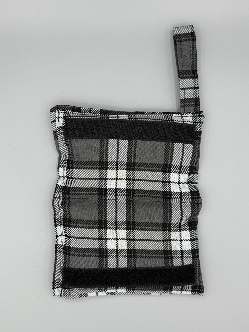 Charcoal Plaid horse bit warmer open with velcro inside displayed