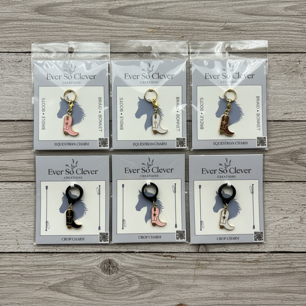 Packages of cowboy boot charms on wood background