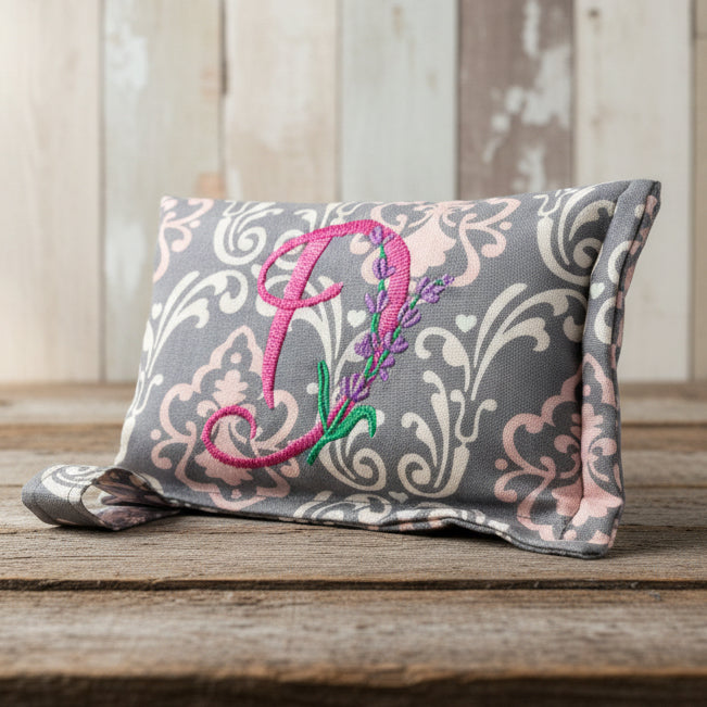 Divine Damask horse bit warmer with "D" personalization on wooden background