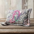 Divine Damask horse bit warmer with "D" personalization on wooden background