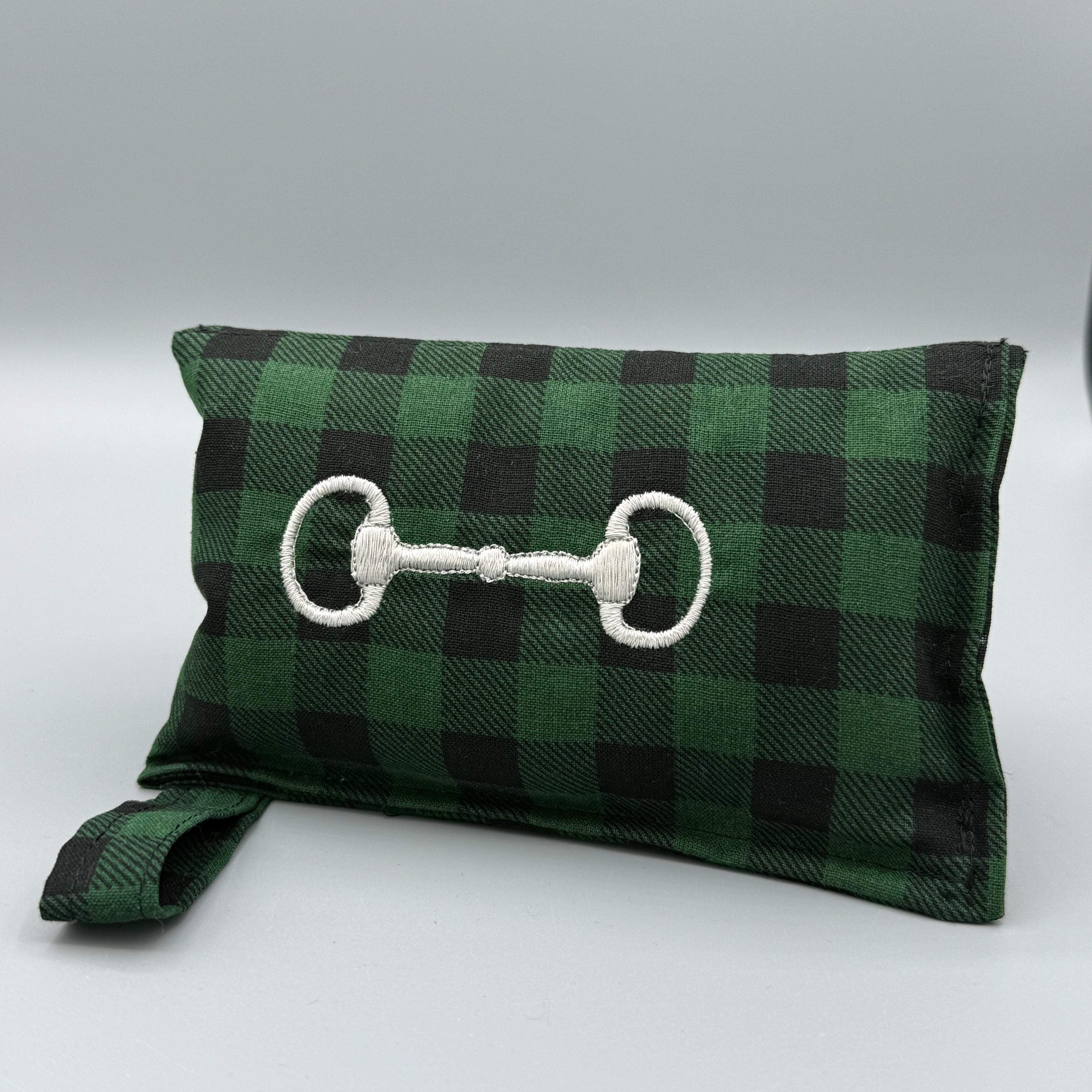 Green Buffalo Plaid horse bit warmer with snaffle bit personalization on grey background