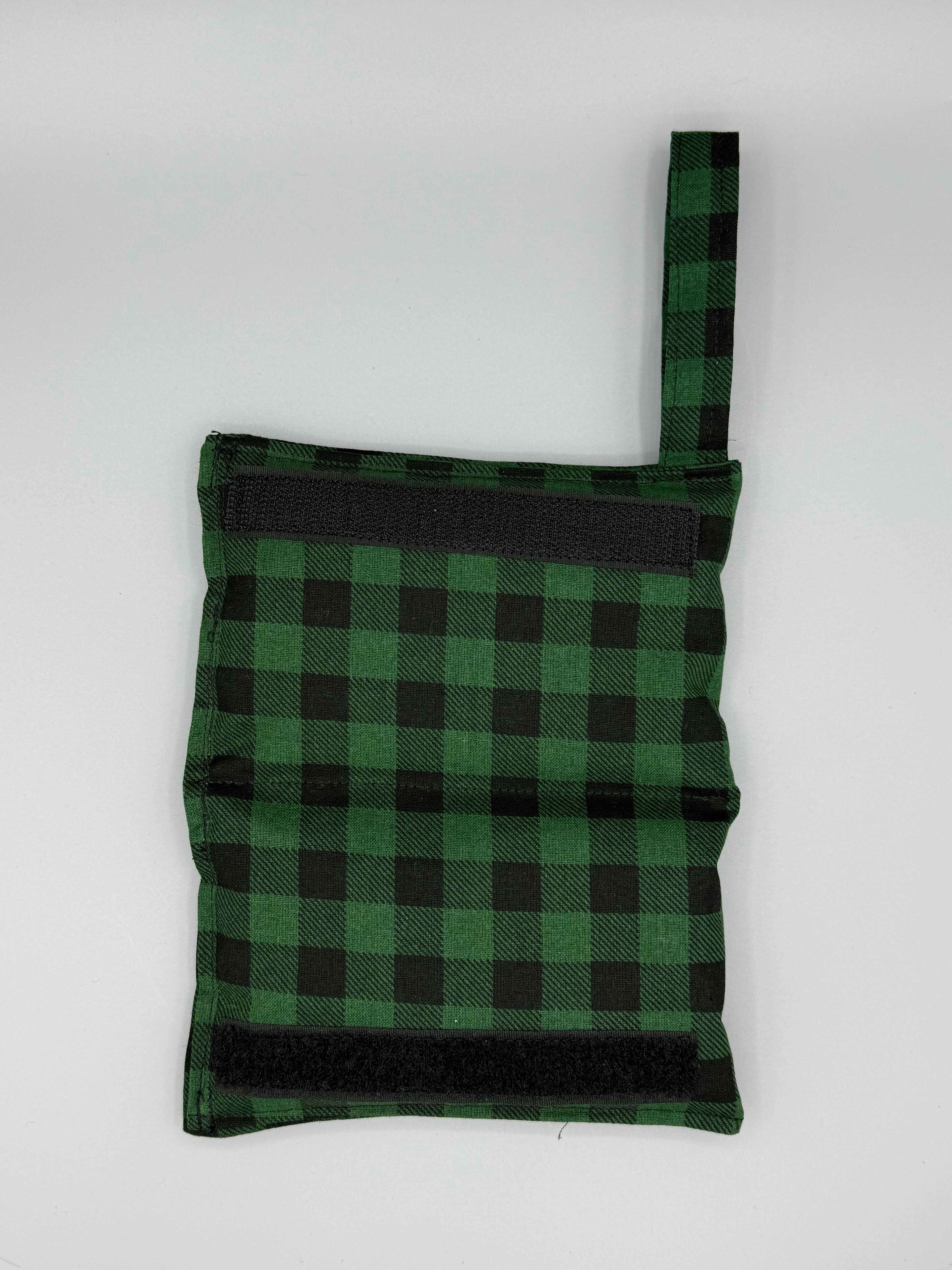 Green Buffalo Plaid horse bit warmer open with velcro inside displayed