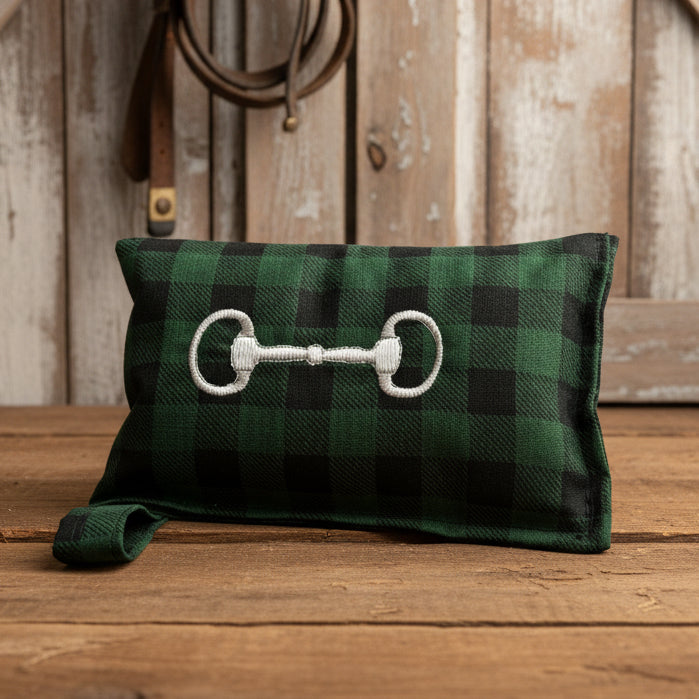 Green Buffalo Plaid horse bit warmer with snaffle bit personalization on wooden background