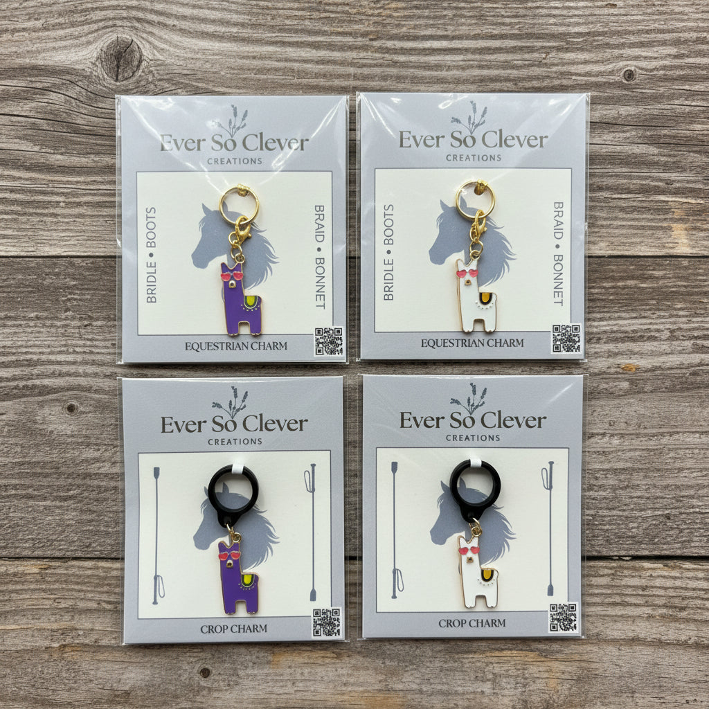Four packages of Ever So Clever Creations lovely llama charms on wood background