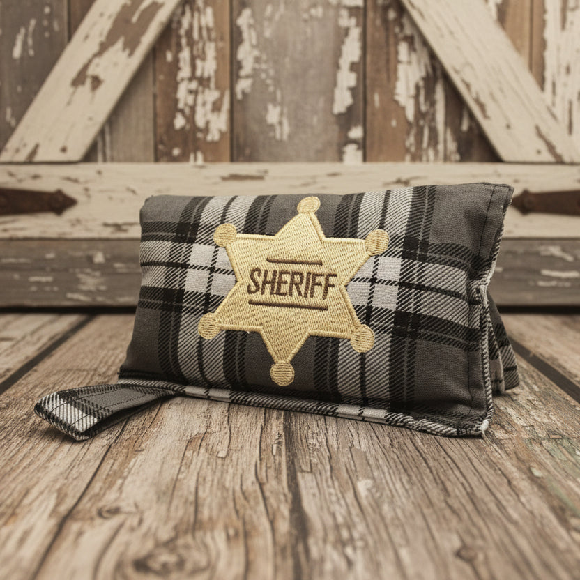 Charcoal Plaid horse bit warmer with Sheriff badge personalization on wooden background