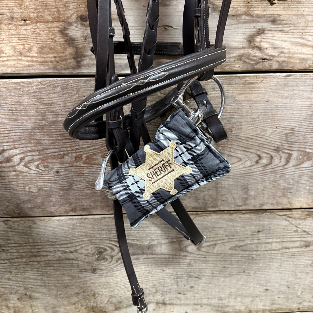 Charcoal Plaid horse bit warmer with Sheriff badge personalization on hanging bridle