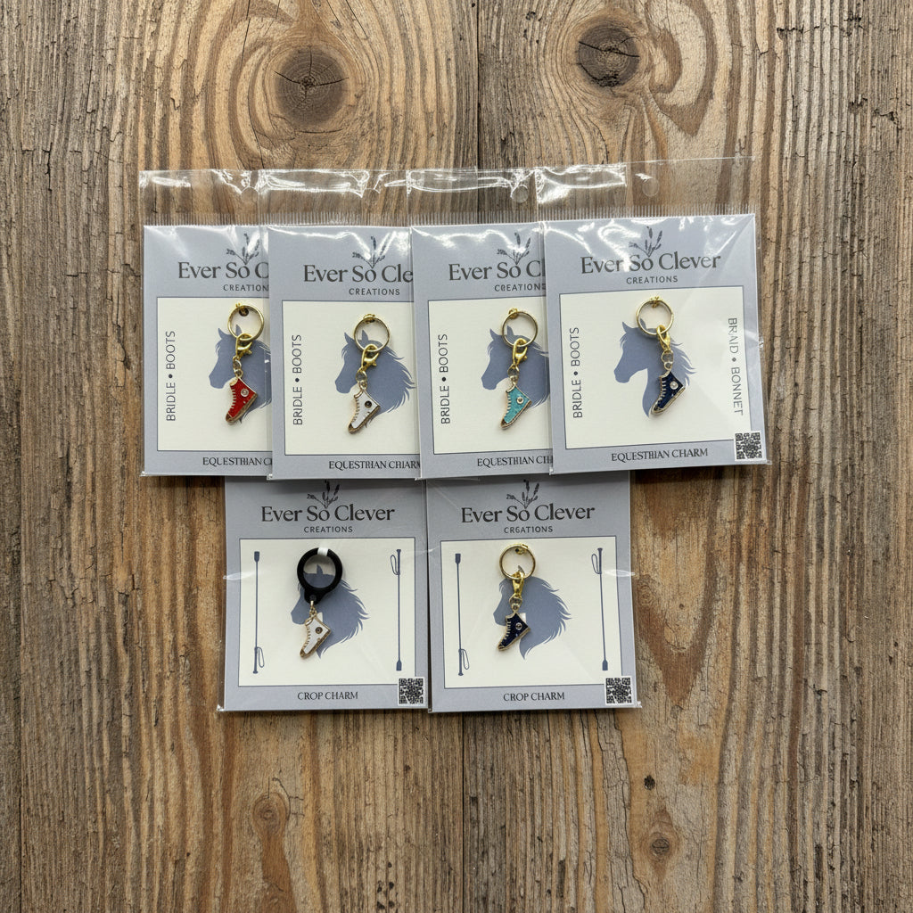 Ever So Clever Creations sneaker charms in packages on wood background